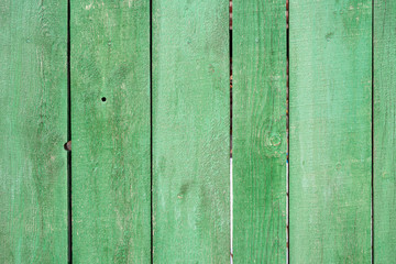 Background image of a green painted wooden fence texture