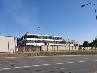 Street and old abandoned factory building