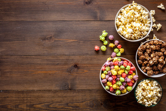 Colored Popcorn In Box On Wooden Background Top View Copy Space