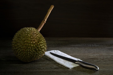 Prepare peeled Durian Thai fruit on gray wooden table and dark wall