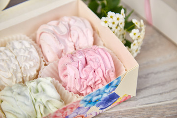 Fototapeta na wymiar Gift box with homemade pastel multi color marshmallows.