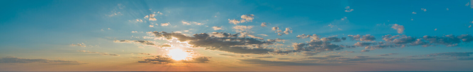 Large panorama with sunset sky with multicolor clouds
