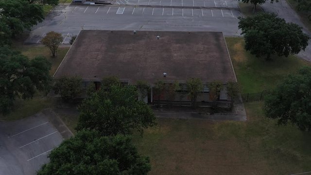 Commercial building behind the trees, Bryan, Texas, USA