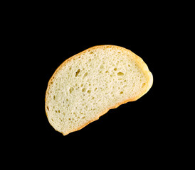 loaf of white bread isolated on black background