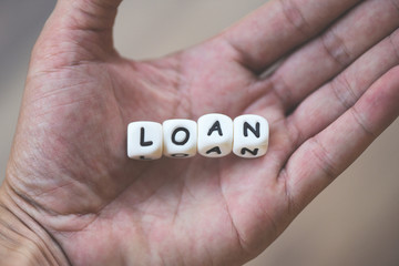 Financial loan or lending for car and home loan agreement and approval concept - word of loan in hand