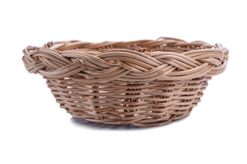 Obraz premium Empty wicker basket isolated on white background