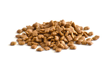 Dry cat food on white background.  Selective focus.