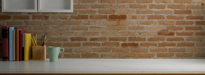 Close up view of trendy worktable with stationery, coffee mug and copy space