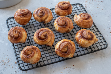 Puff pastry cinnamon rolls on a tray
