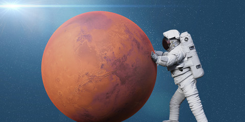 Obraz na płótnie Canvas astronaut and planet Mars, world of the solar system