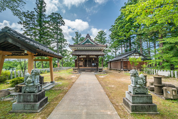 Komainu Lion-Dog guardians of Tsuruoka Gokoku Jinja shinto shrine. located in Tsuruoka Park. Yamagata, Japan