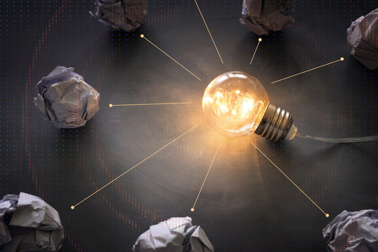 Education concept image. Creative idea and innovation. Light bulb as metaphor over blackboard