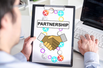 Partnership concept on a clipboard