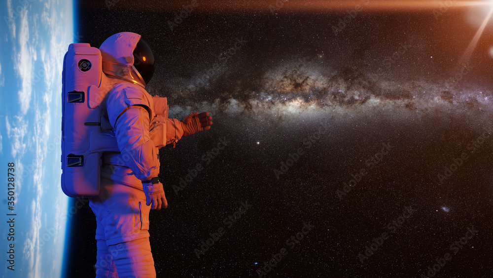 Wall mural astronaut presenting an empty space in front of planet earth and the milky way galaxy