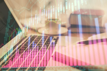 Double exposure of financial chart drawing and desktop with coffee and items on table background. Concept of forex market trading