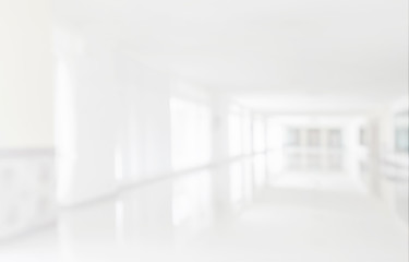 Empty white office corridor blurred background
