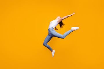 Fototapeta na wymiar Full length body size view of her she nice attractive lovely graceful flexible healthy strong girl jumping dancing contemporary isolated on bright vivid shine vibrant yellow color background