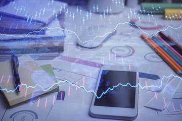 Double exposure of forex graph drawing and cell phone background. Concept of financial data analysis