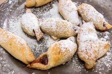 Fototapeta na wymiar Homemade baking with powdered sugar as traditional holiday cookie closeup.