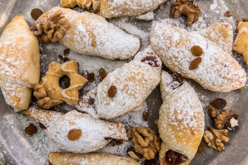 Tasty baked and sprinkled with powdered sugar bagel and bun