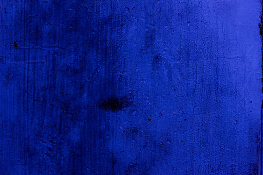 Blue colored abstract wall background with textures of different shades of blue