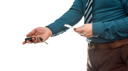 businessman holding euro banknotes and car keys isolated on white background closeup. Buy or rent car concept.