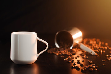A white beautiful cup of tea or freshly brewed coffee stands on a beautiful dark golden cezve background