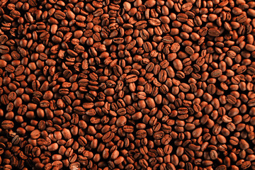 roasted coffee beans, can be used as background. Grains after roasting on golden