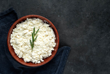 cottage cheese in a bowl on a stone background