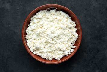 cottage cheese in a bowl on a stone background