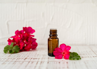 Geranium oil in glass dark bottles. Pelargonium oil. Aromatherapy