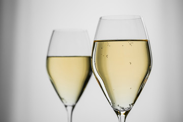 White wine in a beautiful glass on grey background