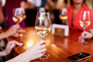 glass of wine in hand