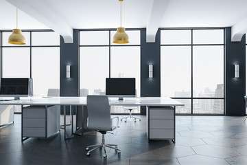 Empty computer in contemporary office interior