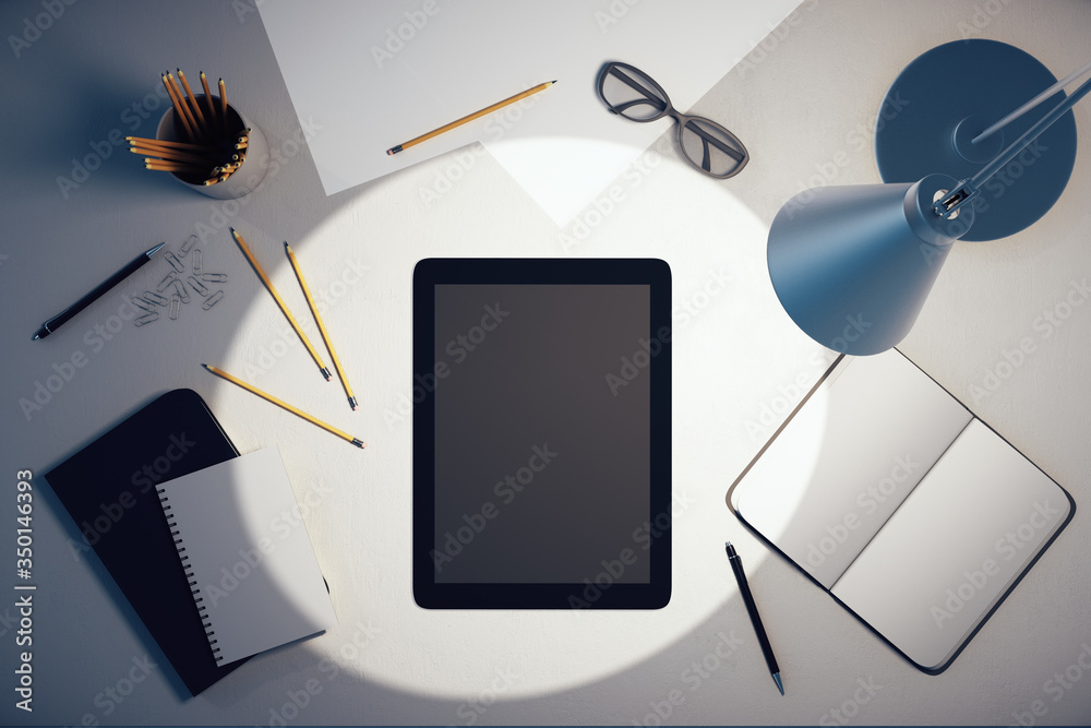 Poster top view of empty black tablet screen and other accessories on office desk.
