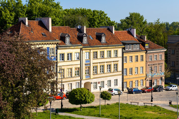Fototapeta na wymiar Panoramic view of historic, richly decorated colorful tenement houses at Bugaj, Mostowa and Brzozowa streets of Starowka Old Town quarter in Warsaw, Poland