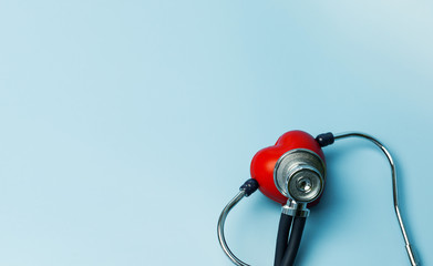 stethoscope and red heart Heart Con blue backgorund