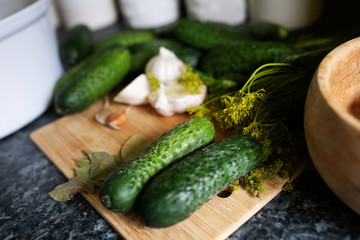 fresh cucumbers on wooden board