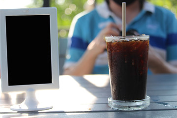 Male customers are eating coffee in a coffee shop with good atmosphere.
