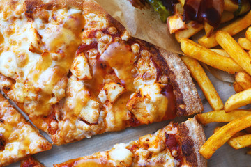 Unhealthy concept. Fast Food - Pizza, Fried Potato. Close up. Popular fast food recipes