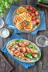 Grilled zucchini fries wrapped in a bacon and halloumi cheese