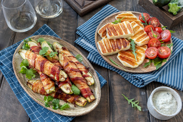 Grilled zucchini fries wrapped in a bacon and halloumi cheese