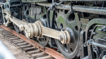 The old iron railway locomotive wheels, closeup