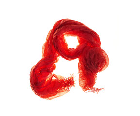 Red amber scarf made of natural sieve cotton cloth with drapery on white isolated background.