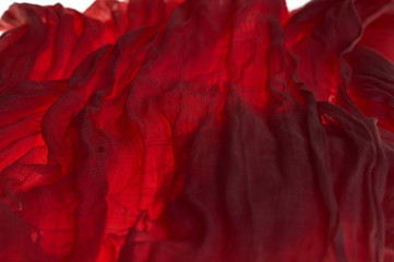 Obraz premium Background or texture of red amber, sieve, cotton cloth and drapery.