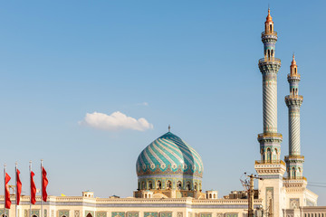 Obraz premium Exterior view of an oriental Mosque with decorative tiles and a dome in Qom, Iran