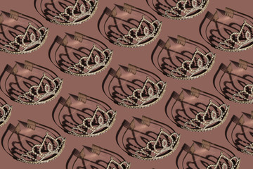 crowns on a pink background. flat lay. pattern