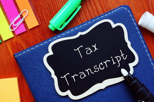 Business Concept About Tax Transcript With Sign On The Sheet.