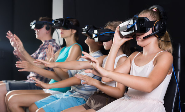 Happy daughter is fascinated of VR with family