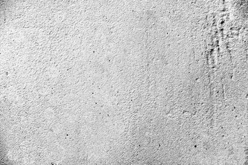 Texture of a concrete wall with cracks and scratches which can be used as a background